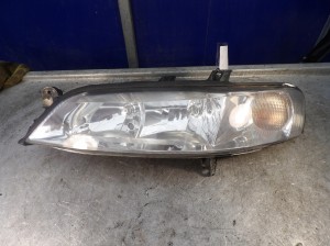 Opel Vectra lampa przednia lewa 09119519 67743035